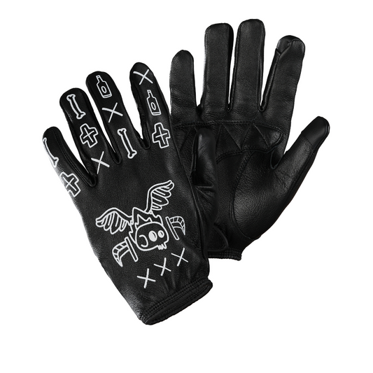 A pair of black leather gloves with a skull and crossbones design and touchscreen-compatible fingertips.